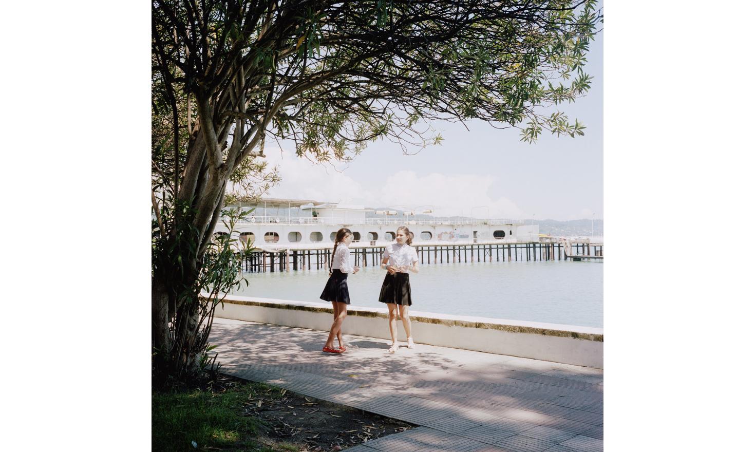 Two young girls along the seaside