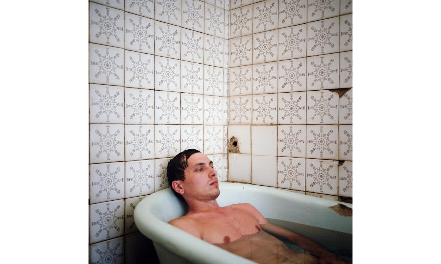 A Russian tourist takes a bath with sulfurous water in a sanitarium in Gagra.