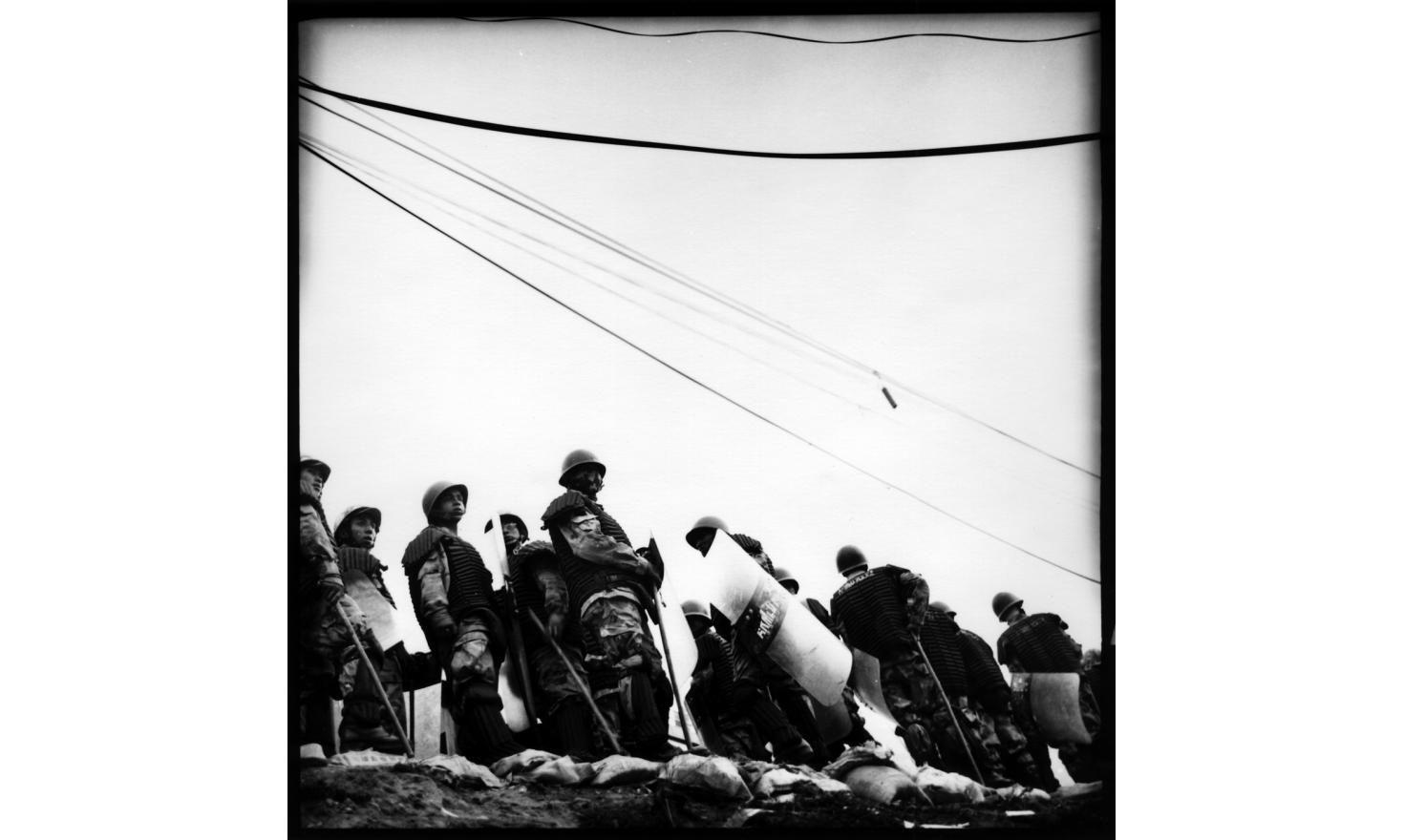 © Agnès Dherbeys / MYOP Riot police standing over a hill in Kalanki, where protestors have been loothing a governemental building, Kathmandu
