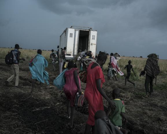 On the road to Ethiopia, displaced people hope to go back inside the boded down truck. South Sudan, May 6th 2017. 